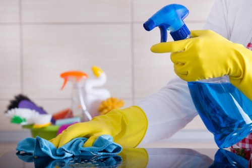Cleaner preparing a Soho flat for move-out handover