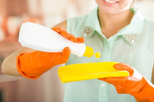Professional cleaners vacuuming fine dust after a refurbishment in Soho